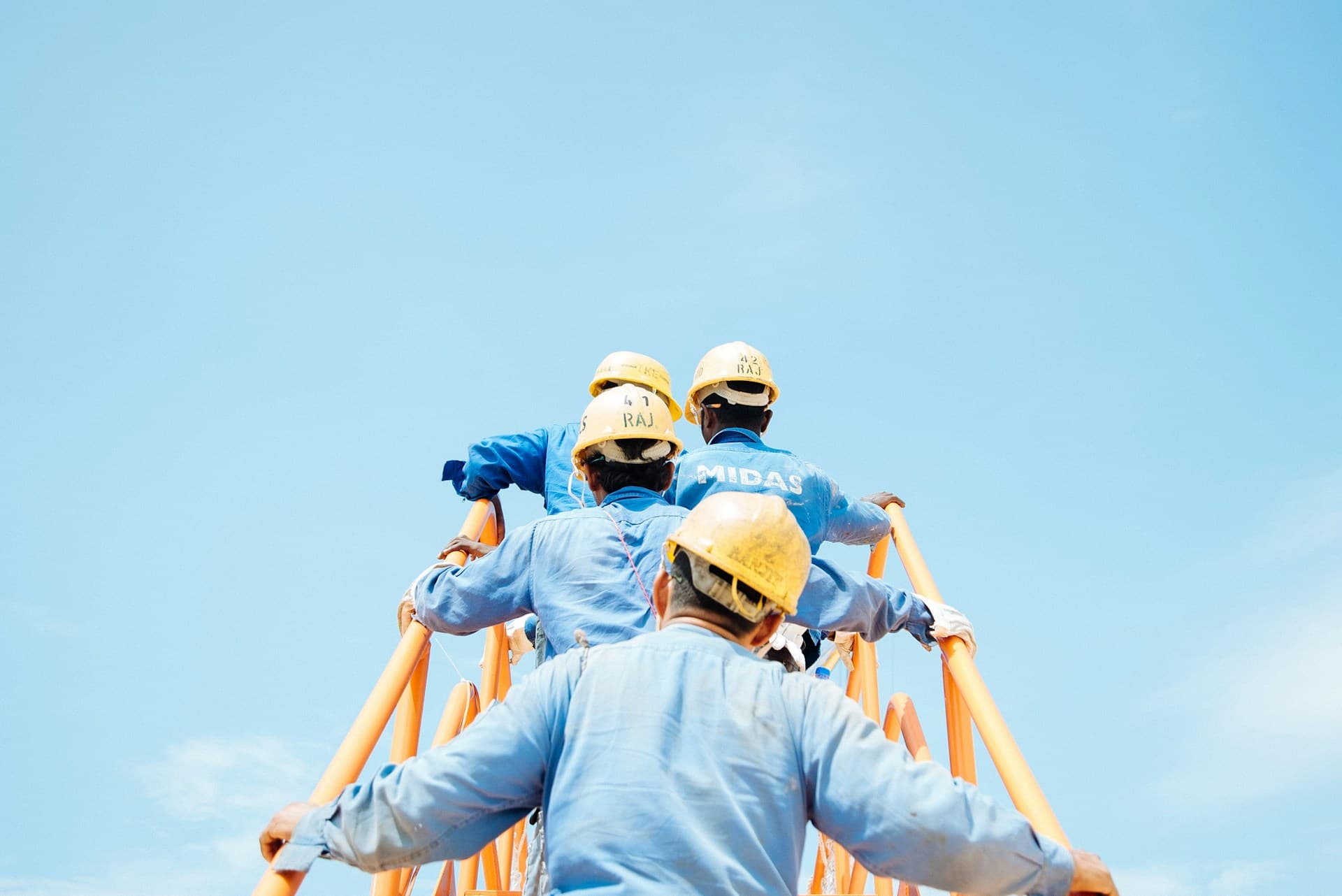 A construction site with cranes and a building under structural work