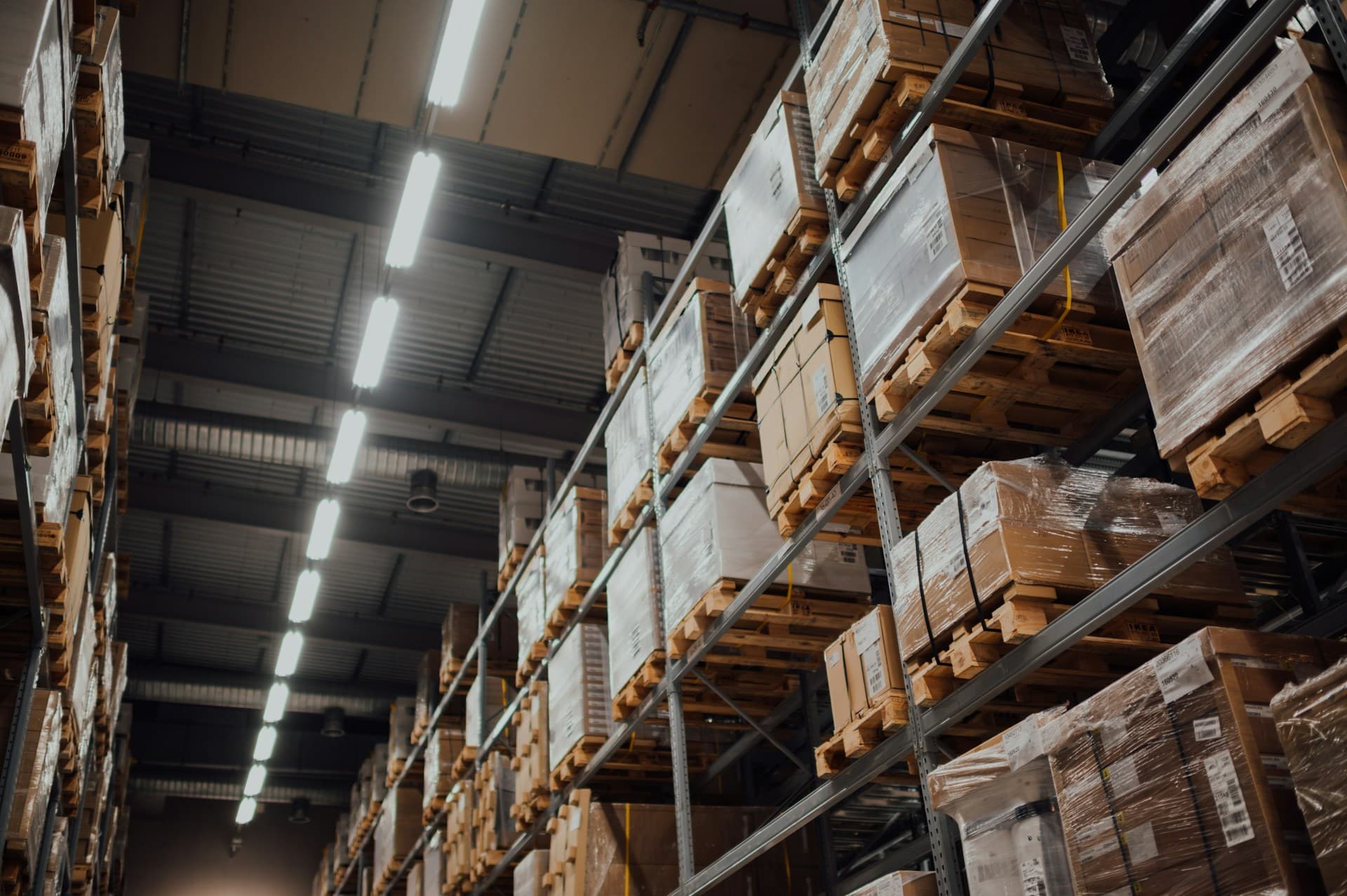 Towering warehouse racking aisle in a distribution center