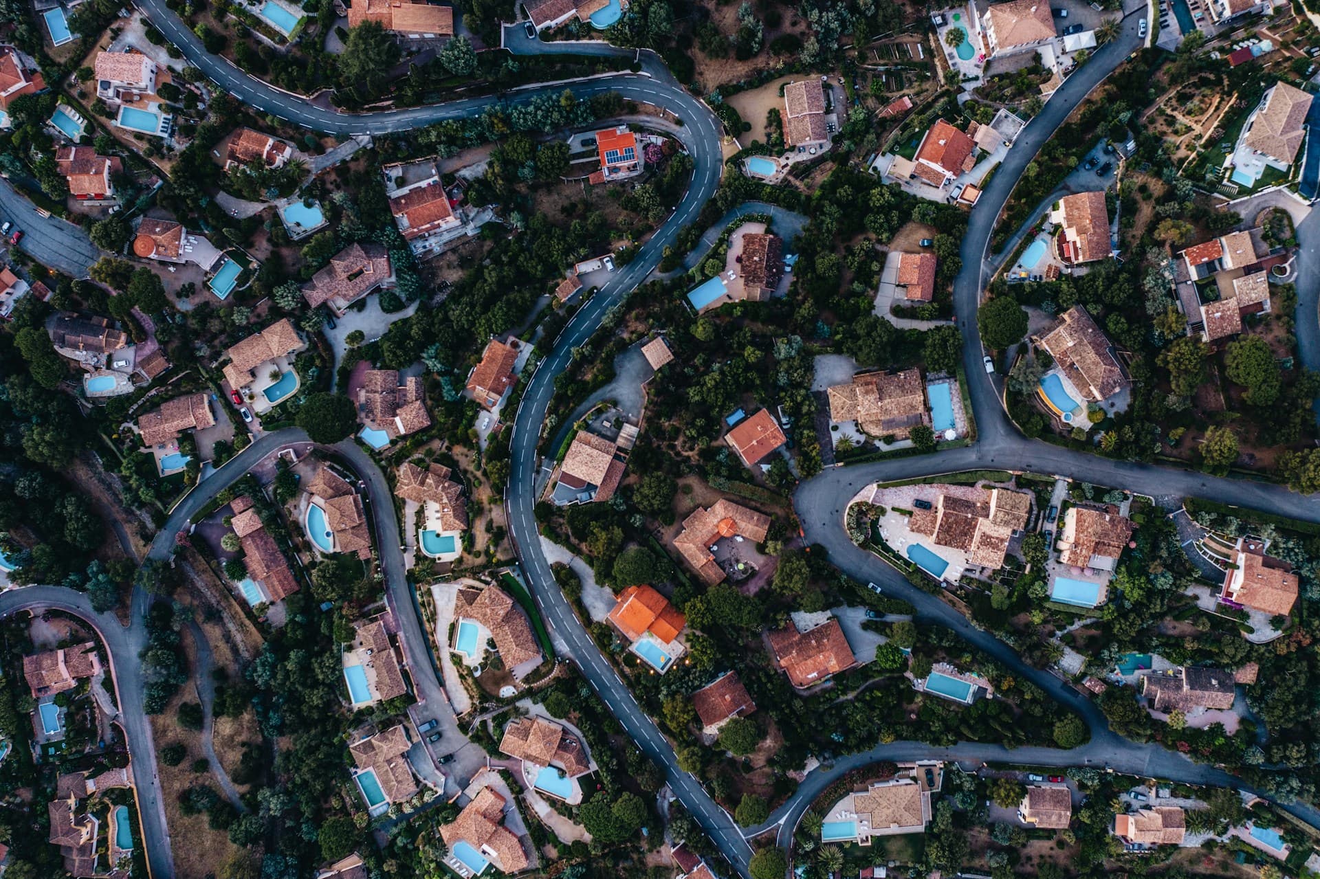 Aerial view of a residential neighborhood of homes and winding streets