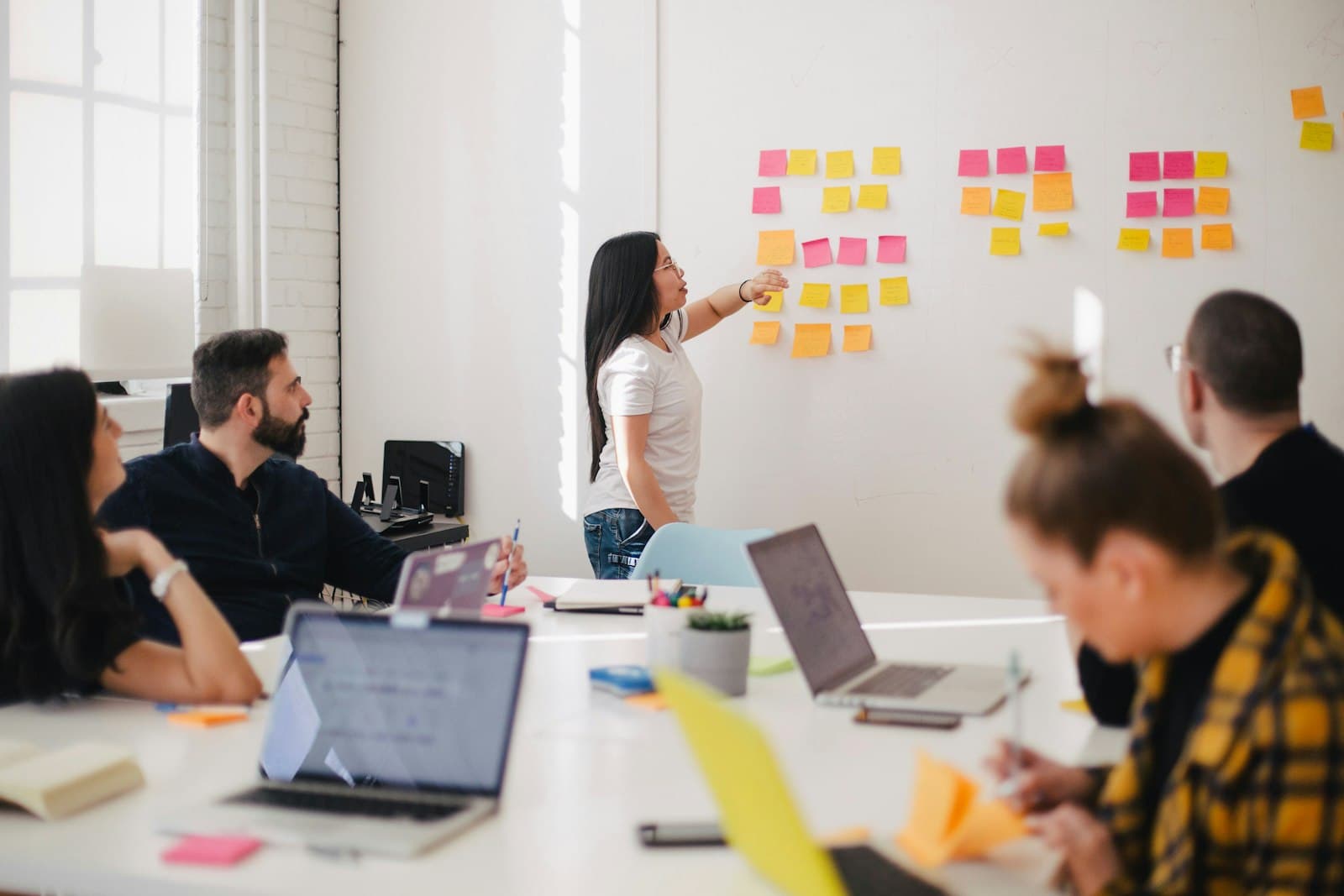 Insurance executives and architects collaborating over a modernization roadmap at a conference table