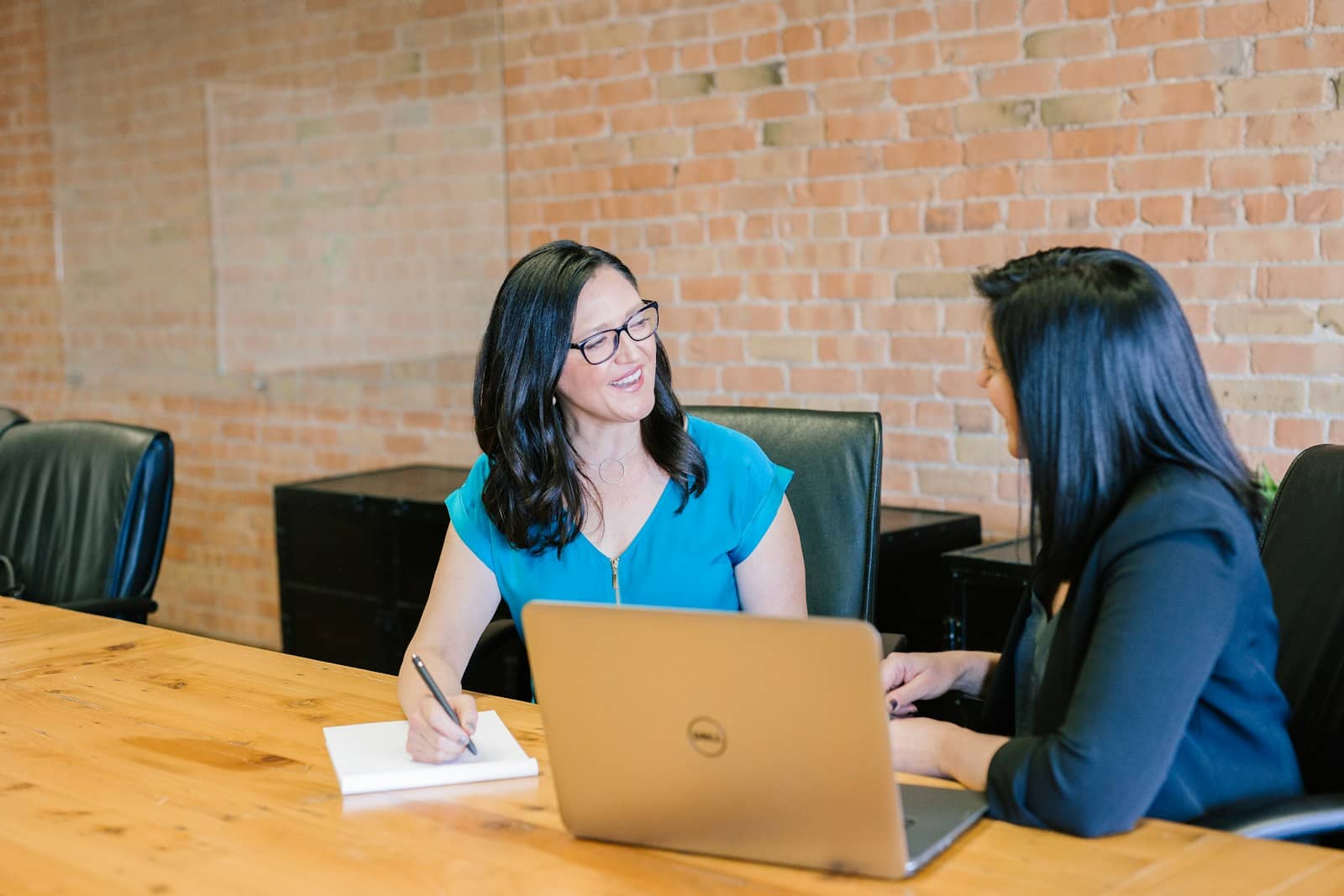 Insurance product team reviewing a quoting workflow on a shared screen in a modern office