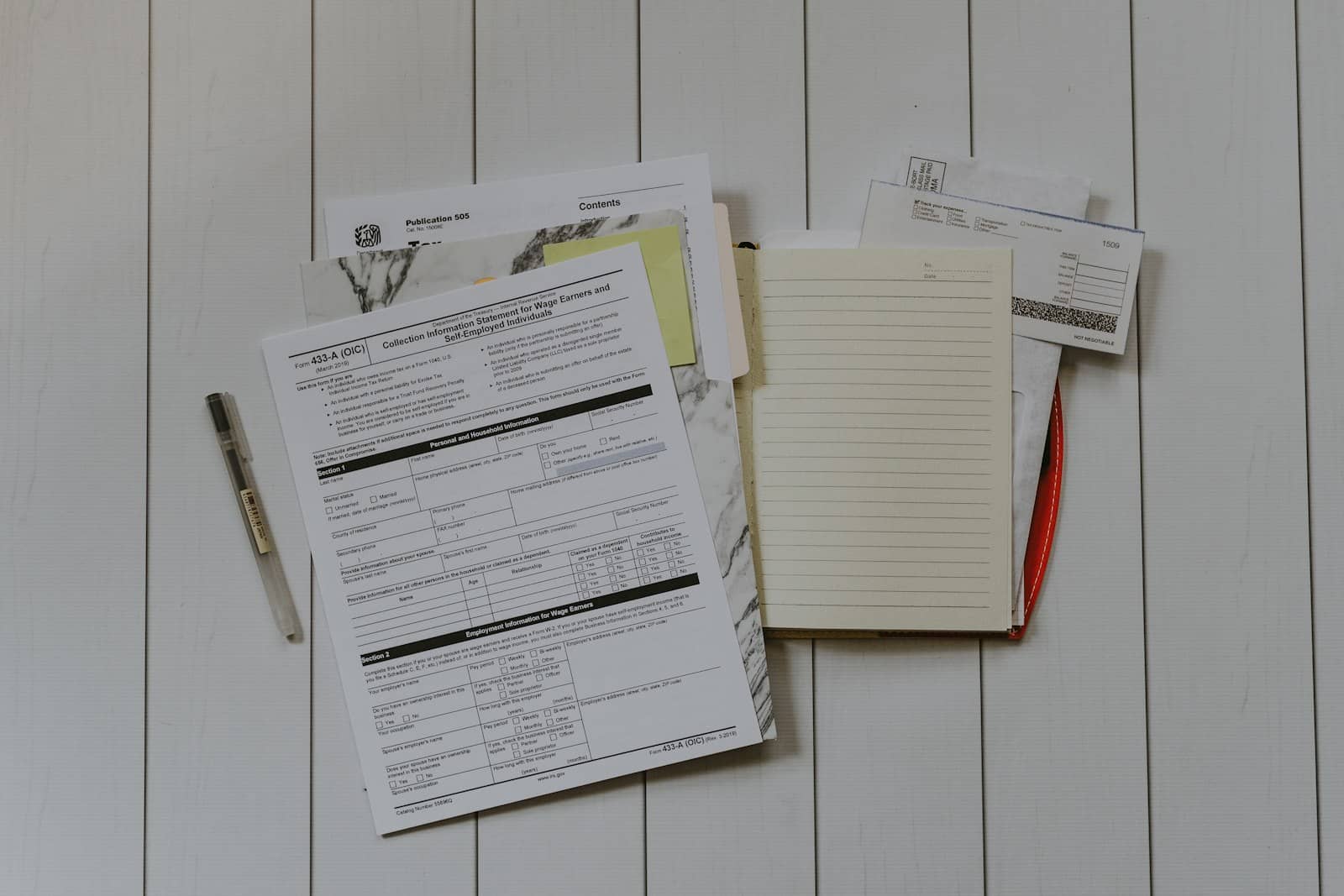 Regulatory affairs professional reviewing submission documents at an office workstation